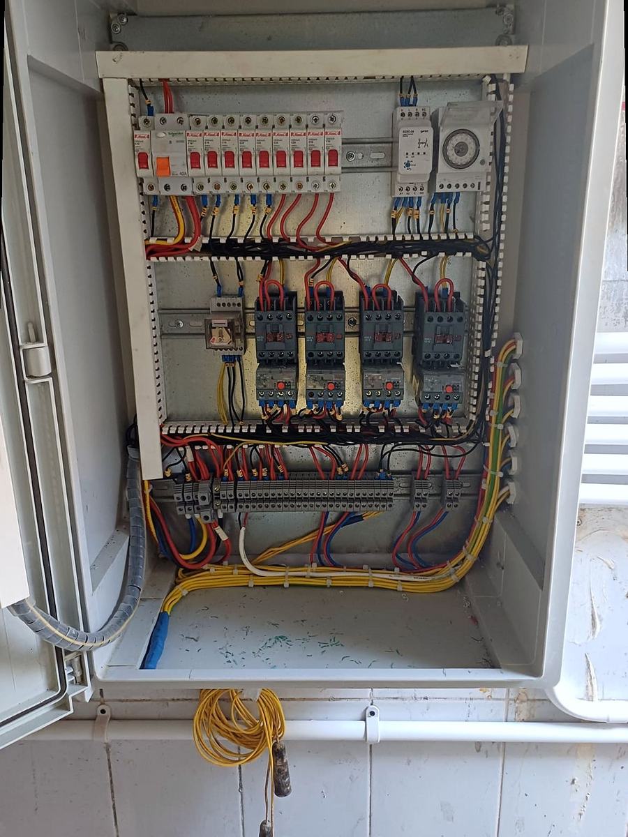 Contactors, overloads and a time switch in a motor control panel
