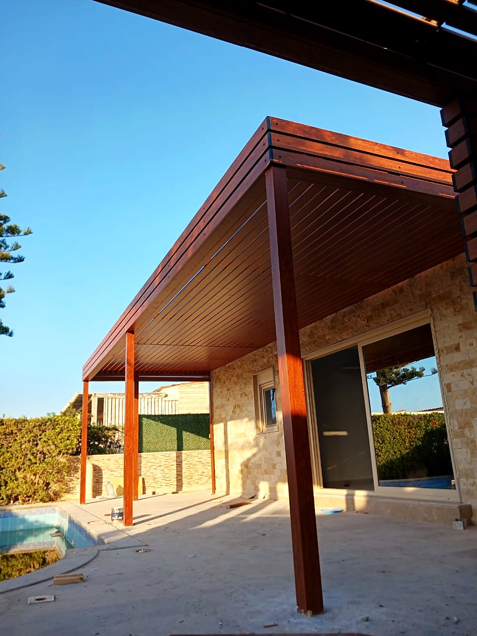Timber pergola along the villa side