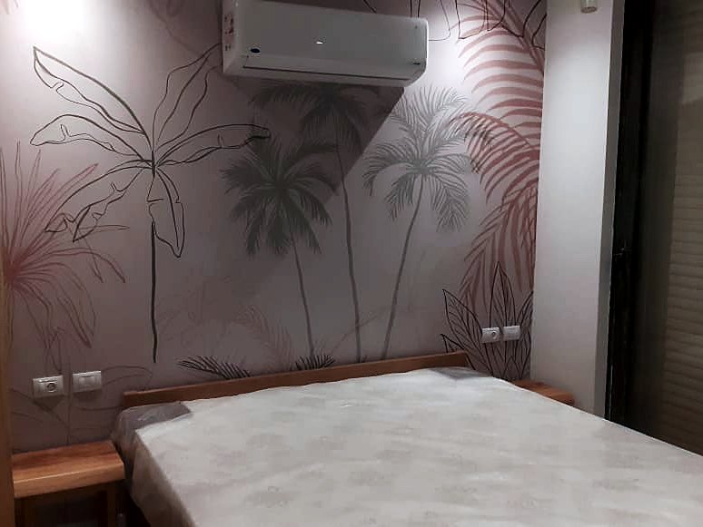 Botanical mural to a bedroom feature wall — private villa