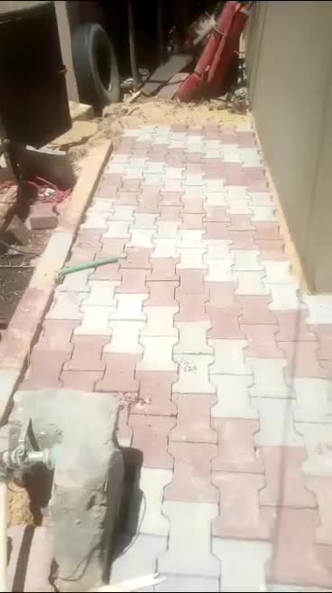 Interlock walkway with kerb edging along a building