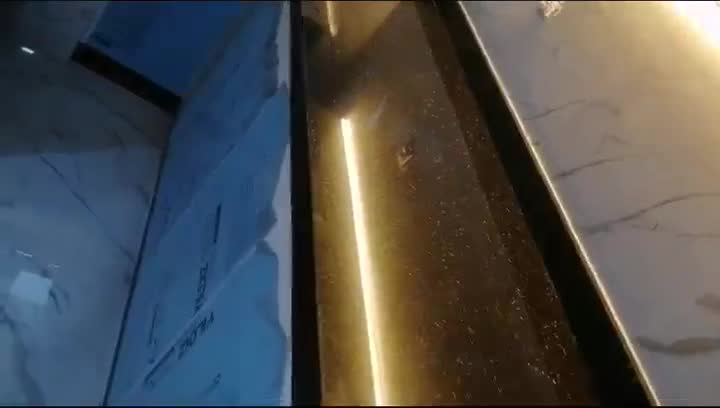 Black granite kitchen worktop with LED strip lighting