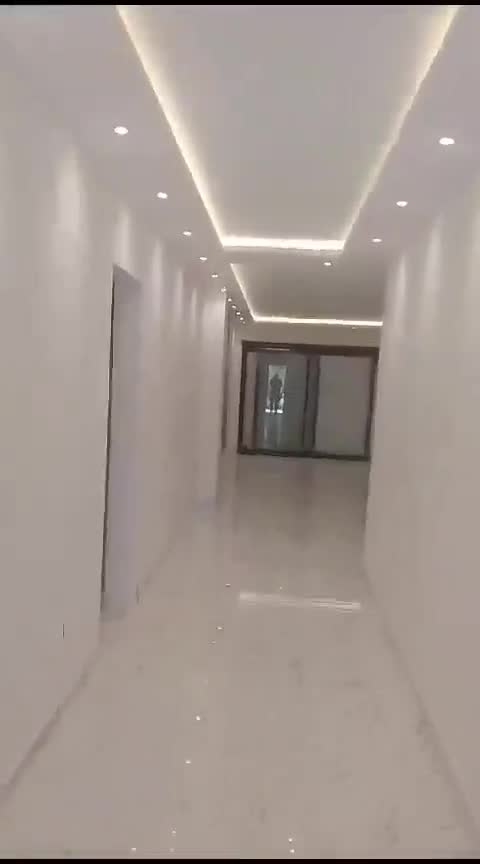 Finished corridor and hall with cove lighting; marble feature wall in the bathroom